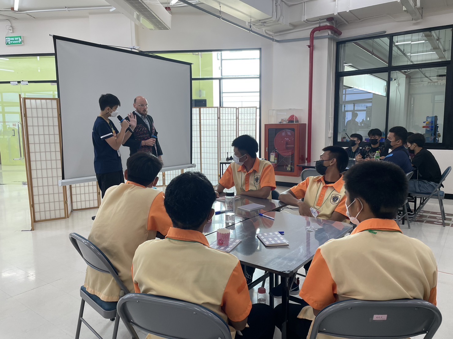Tul speaking with workshop participants