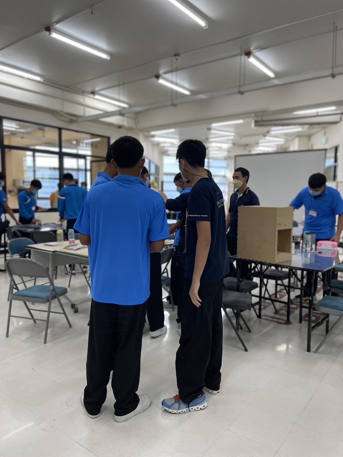Tul helping a participant with an activity