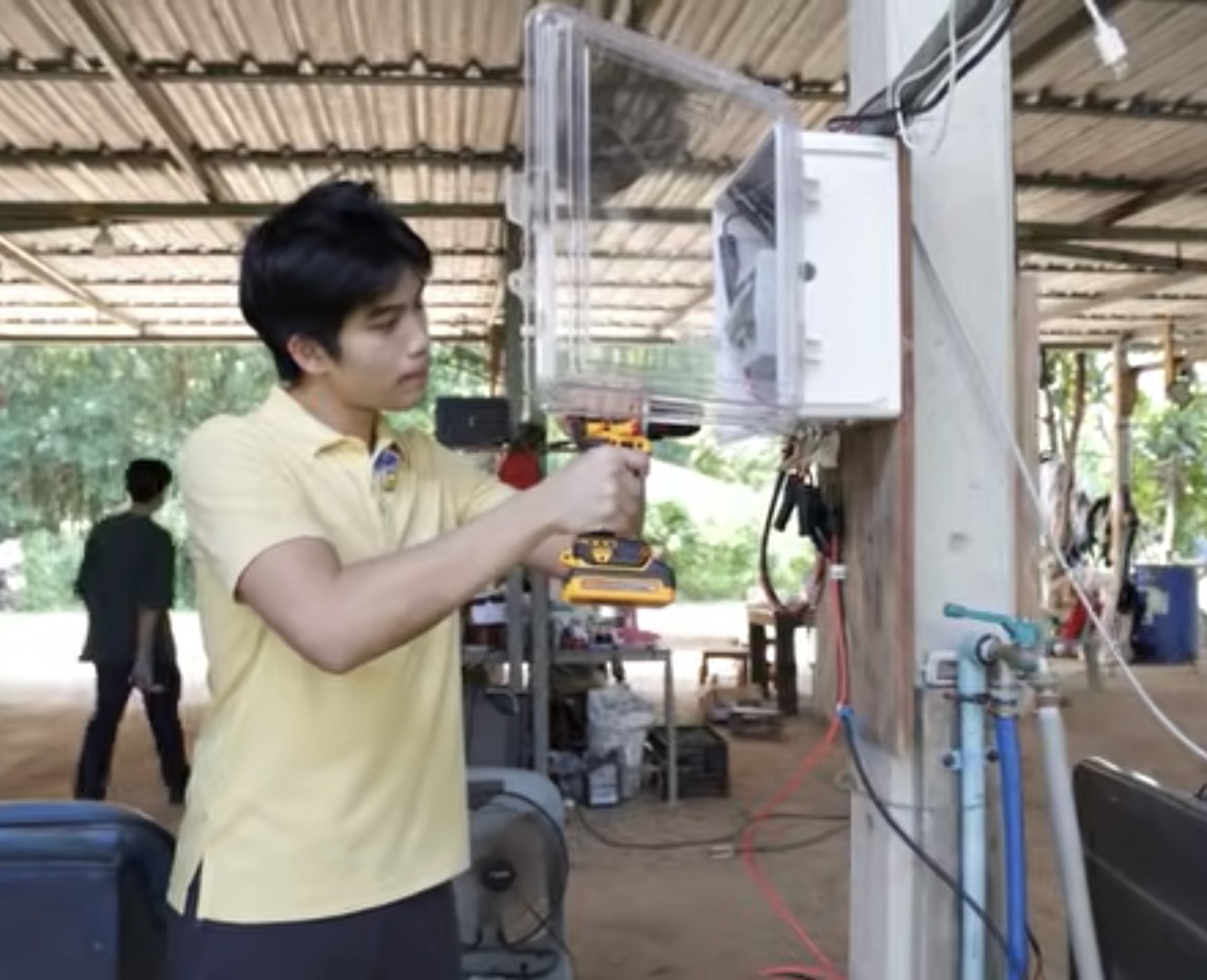 Tul working on the RaiSmart installation at the farm